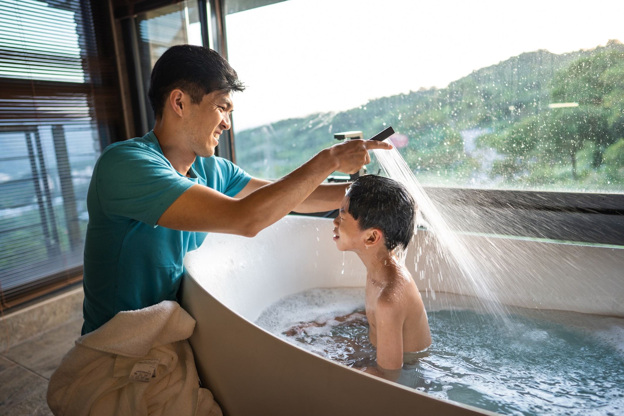 Father cleaning his son